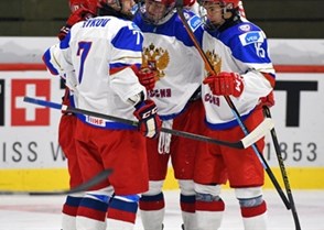 LUCERNE, SWITZERLAND - APRIL 17: Russia's Yegor Rykov #7, Danil Yurtaikin #13, Nikolai Chebykin #8 and German Rubtsov #15 celebrate after a first period goal against Germany during preliminary round action at the 2015 IIHF Ice Hockey U18 World Championship. (Photo by Matt Zambonin/HHOF-IIHF Images)

