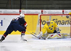 LUCERNE, SWITZERLAND - APRIL 19: USA's Christian Fischer #21 with a scoring chance against Sweden's Felix Sandstrom #29 during preliminary round action at the 2015 IIHF Ice Hockey U18 World Championship. (Photo by Matt Zambonin/HHOF-IIHF Images)